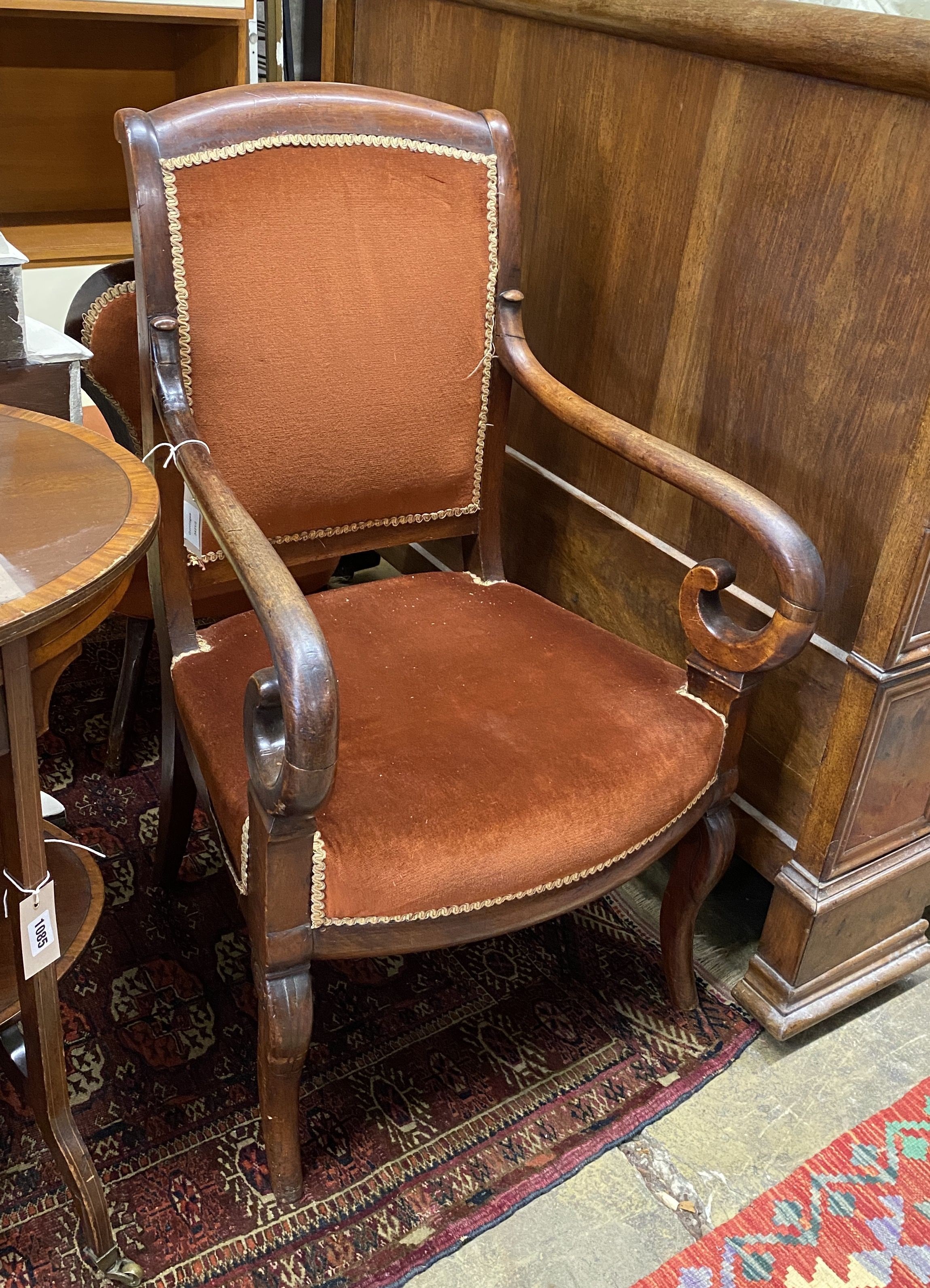 A French Empire mahogany fauteuil, with scroll over arms, width 56cm, depth 48cm, height 96cm